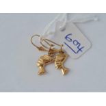 A pair of gold Egyptian head earrings