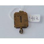 An antique brass stamp holder & scales