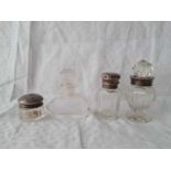 Three silver mounted scent bottles and another