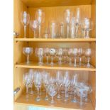 Three shelves tumblers and wine glasses