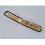 A boxed gold stick pin with cross terminal with good diamond inset diamond – 4 gms