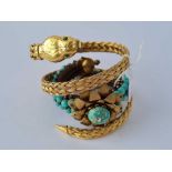 A gilt snake bracelet and a turquoise bracelet