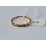 A gold half eternity ring set with diamonds 18ct gold size W ½ – 2.4 gms