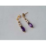 A pair of stone set drop earrings in 9ct