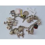 A heavy silver charm bracelet 10 inches
