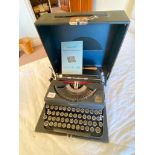Imperial 'Good companion' Model T portable typewriter with instruction book and brush