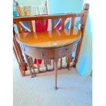 A Georgian style semi circular card table with folding top and pad feet