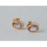 A pair of amethyst set earrings 9ct