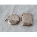 A circular hammered vesta case, Birmingham 1910 and another scroll engraved, Birmingham 1903