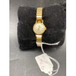A ladies rolled gold TISSOT wrist watch