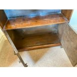 An art deco period small oak bookcase with cupboard to base, 24" wide