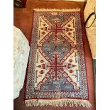 Oriental rug with centre medallion 4'2" x 2'6"