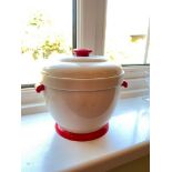A red and cream coloured ice bucket and cover