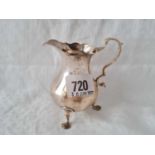 Georgian cream jug on three legs. 4” high. London 1763 by S M?