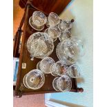 Two sets of five grapefruit glasses and three cut and etched bowls and spoon