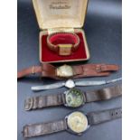 A gents INGERSOLL wrist watch in box together with four others
