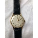 A GOOD GENTS TUDOR GOLD WRIST WATCH WITH SECONDS DIAL 9CT W/O ON LEATHER STRAP