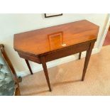 A George III mahogany card table with satin wood stringing and straight tapering legs, 3" wide