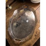 Attractive oval tray with pierced border, recessed handles. 20” wide