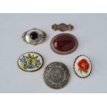 Six assorted silver brooches