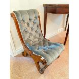 A 19th Century mahogany nursing chair with buttoned back and seat