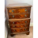 A small tall boy chest of five long drawers on bracket feet, 18" wide and 28" high