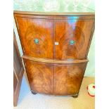 A bow fonted mahogany drinks cabinet with four doors and plate glass top, 29"wide