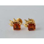 A pair of high carat gold screw back earrings set with citrines (one chipped stone) – 6.9 gms