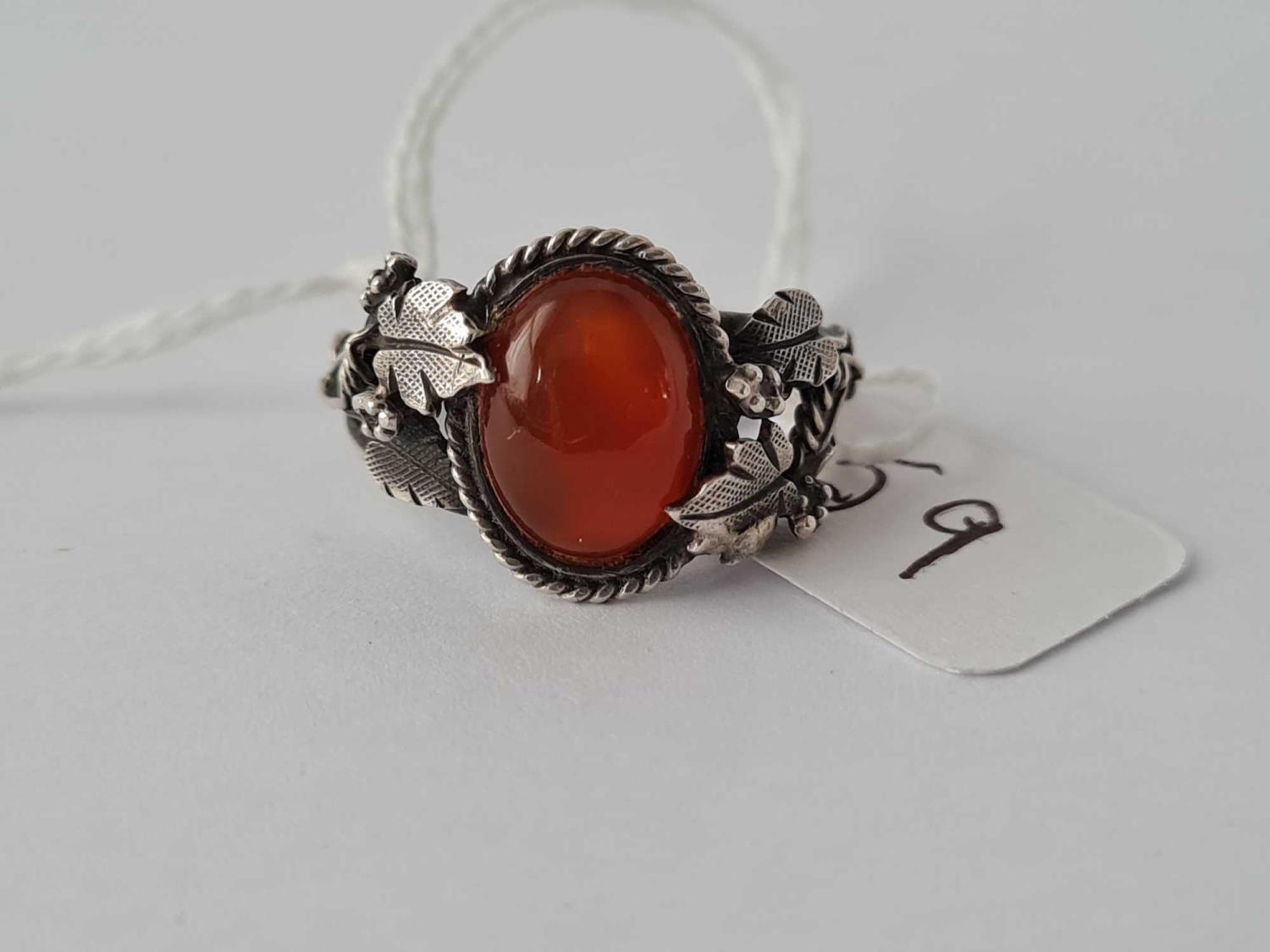 A arts and crafts silver and carnelian ring size O