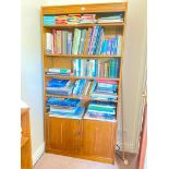 An oak finish bookcase with a cupboard below, 36" wide x 6ft high