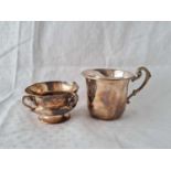 A foreign silver christening cup and a small four handled cup – London 1908 by Barnard Brothers – 86
