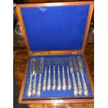 Set of twelve lily pattern knives and forks in fitted box