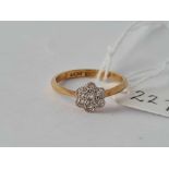 A Edwardian diamond daisy cluster ring 18ct gold size K – 2 gms