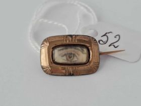 A hand painted eye miniature in gold Georgian brooch frame