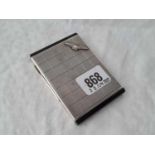 An attractive RAF cigarette case with checkered decoration and onyx ends, import mark 1935, 96g