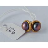 A pair of black pearl earrings