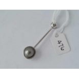 Unusual modern 18ct hallmarked pendant mounted with a grey pearl in a diamond set mount, weight