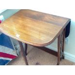 A mahogany Sutherland table with pierced ends, 23 wide