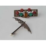 A Edwardian silver and paste umbrella brooch and silver art deco flower brooch