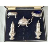 Five piece cruet set in fitted box of Georgian design. Birmingham 1929. 265gms excluding BGL