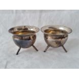 A pair of cauldron shaped salts each on three legs – Sheffield 1904 by M&W