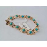 A turquoise flower design 9ct bracelet 7g inc