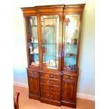 Reproduction Mahogany break front cabinet with glazed top. cupboards under