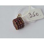 A gold mounted garnet cube pendant, 3.5g