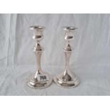 A pair of candlesticks with baluster shaped stems, 6" high, Birmingham 1912
