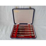 A boxed set of six Queen’s pattern silver handled tea knives
