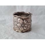 An unusual wide napkin ring chased with pansies dated 1904, 2" deep