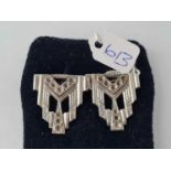 A pair of silver and art deco collier pins