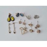 Eight pairs of silver earrings