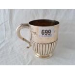 A Victorian half fluted Christening mug with decorative handle, 3.3/4" high, London 1892, 125g